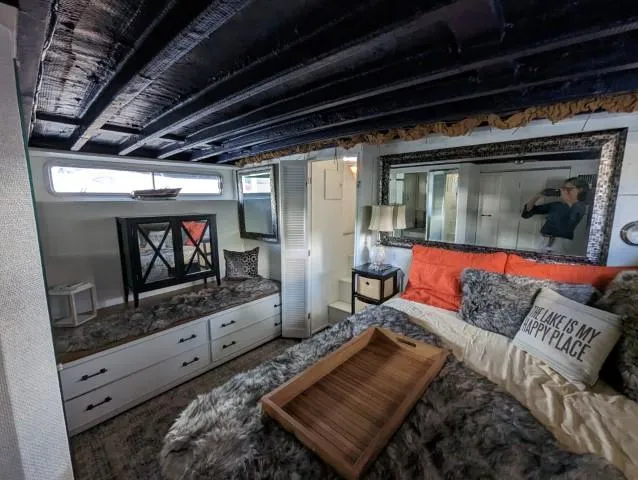 Slide: The Image of Interior of a 1972 Chris-Craft 41 Commander with cozy bedroom decor and nautical accents. - 23