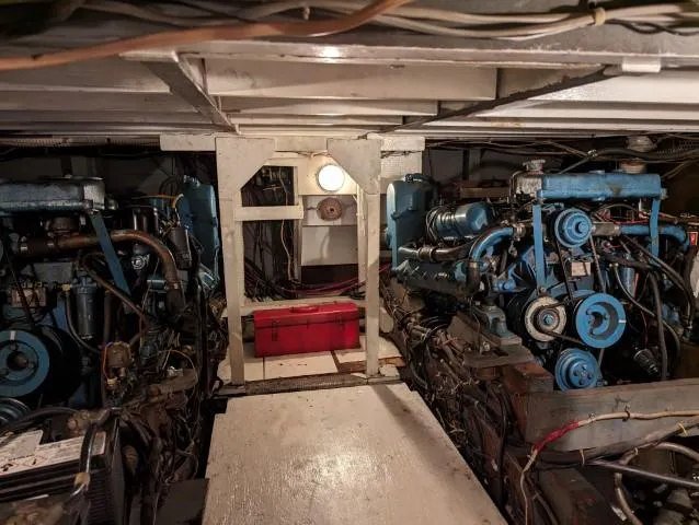 Slide: The Image of Engine room of a 1972 Chris-Craft 41 Commander with visible machinery and equipment. - 25