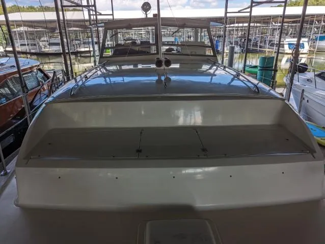 Slide: The Image of 1972 Chris-Craft 41 Commander yacht docked in a marina, showcasing its sleek design. - 6