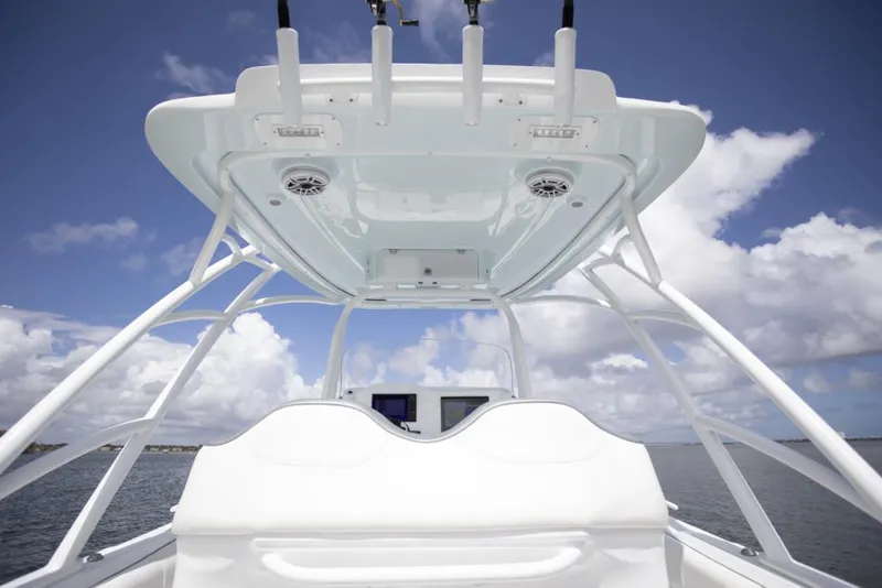 Slide: The Image of 2021 Glasstream 280 SCX boat with Mercury outboard motor in a sunny outdoor setting. - 10