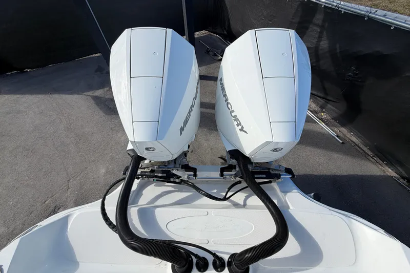 Slide: The Image of Twin Mercury outboard engines on a 2021 Glasstream 280 SCX boat. - 105