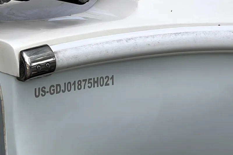 Slide: The Image of 2021 Glasstream 280 SCX boat on trailer, viewed from the front, under clear blue sky. - 17