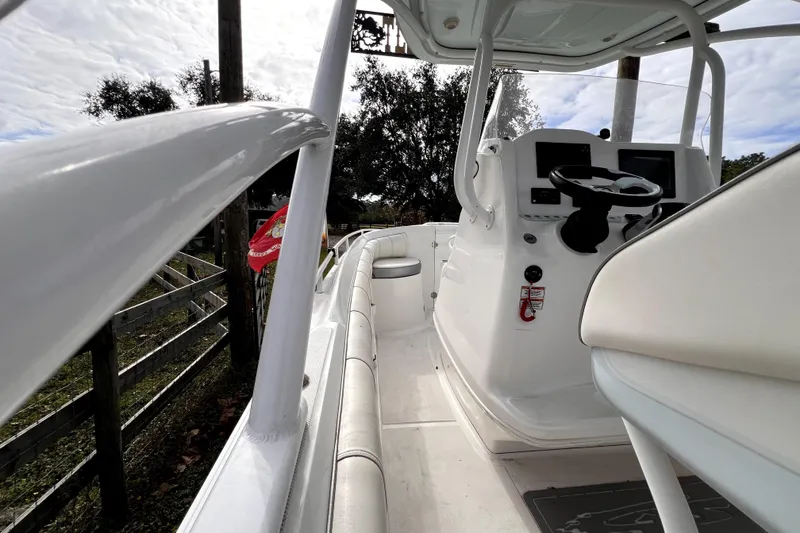 Slide: The Image of 2021 Glasstream 280 SCX boat storage compartment with marina background. - 29