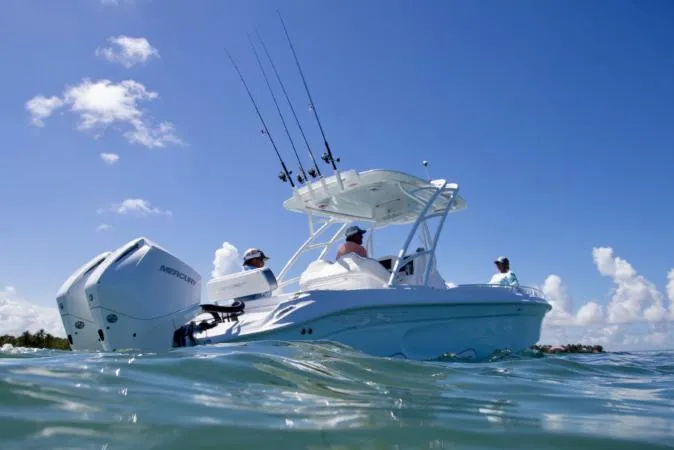 Slide: The Image of 2021 Glasstream 280 SCX boat on trailer with Mercury outboard motor under blue sky. - 3