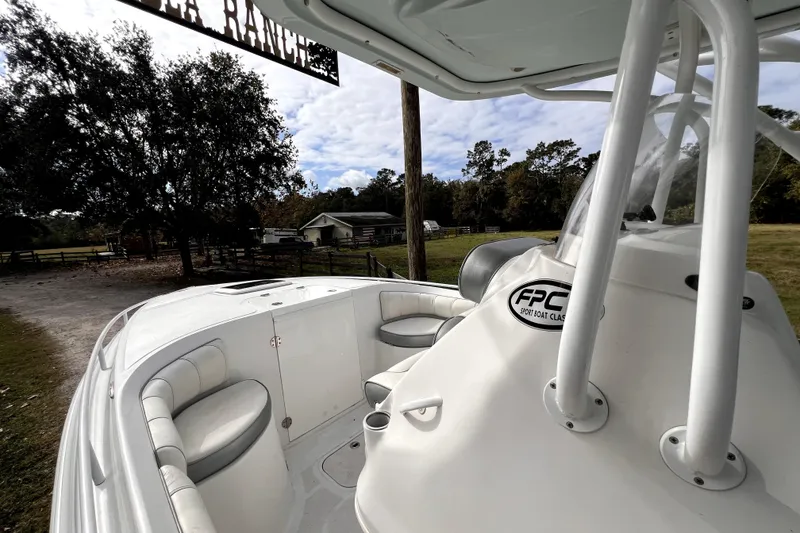 Slide: The Image of 2021 Glasstream 280 SCX boat compartment with oil discharge prohibition notice. - 30