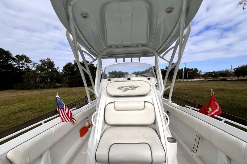 Slide: The Image of Throttle controls on a 2021 Glasstream 280 SCX boat dashboard. - 39