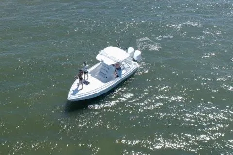 Slide: The Image of 2021 Glasstream 280 SCX boat with Mercury outboard motor in a sunny outdoor setting. - 4