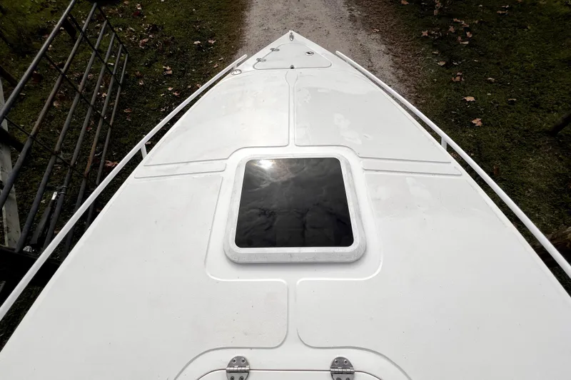 Slide: The Image of 2021 Glasstream 280 SCX boat console with controls and storage compartment. - 41