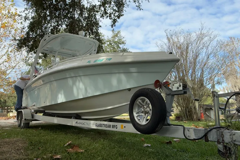 Slide: The Image of 2021 Glasstream 280 SCX boat seating with white cushioned upholstery. - 45