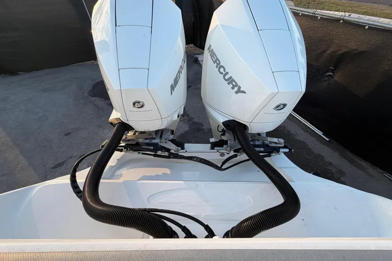 Slide: The Image of 2021 Glasstream 280 SCX boat in a marina with other boats under a blue sky. - 47