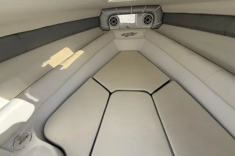 Slide: The Image of Interior cabin of 2021 Glasstream 280 SCX boat with cushioned seating and speakers. - 52
