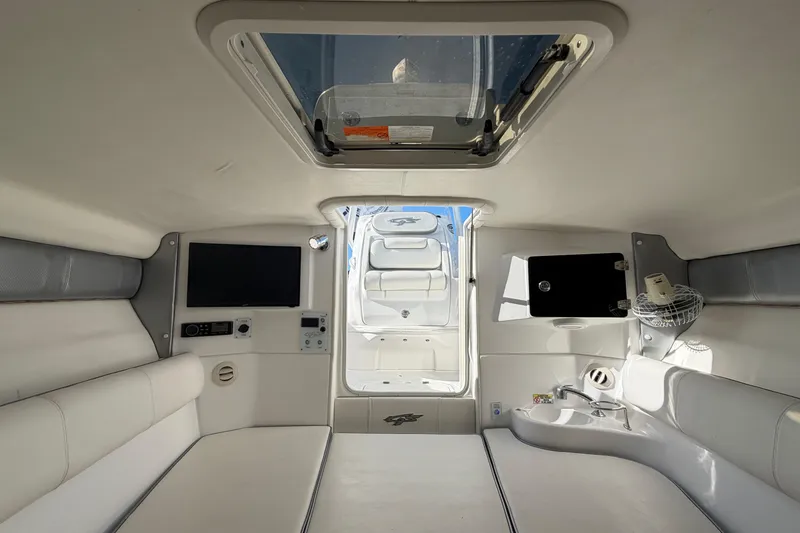 Slide: The Image of Interior of 2021 Glasstream 280 SCX boat, featuring seating, skylight, and modern amenities. - 57