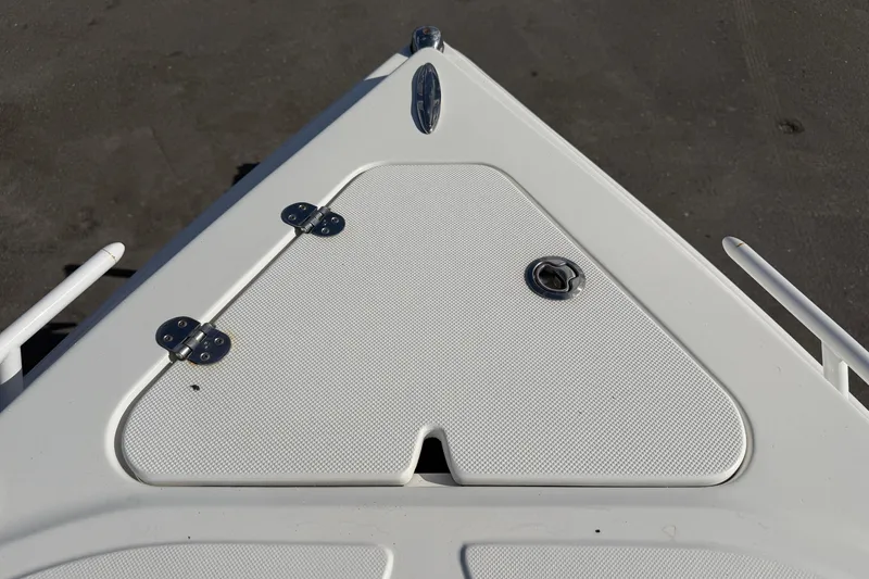 Slide: The Image of 2021 Glasstream 280 SCX boat deck with storage compartment and latch. - 63