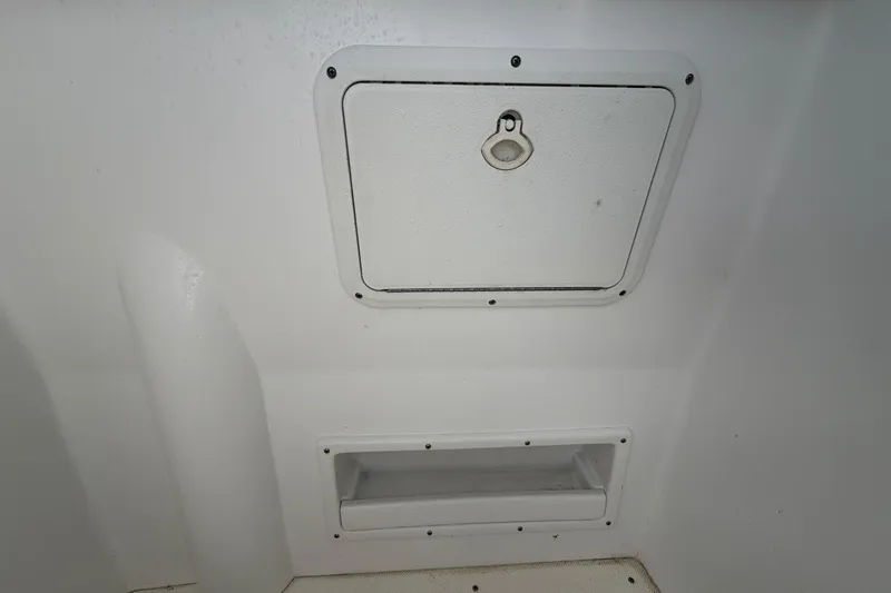 Slide: The Image of 2021 Glasstream 280 SCX boat storage compartment and hatch detail. - 76