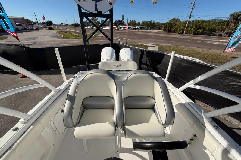 Slide: The Image of 2021 Glasstream 280 SCX boat interior with dual seats and outdoor view. - 81