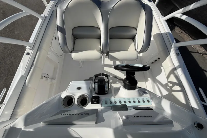 Slide: The Image of 2021 Glasstream 280 SCX boat cockpit with steering wheel and control panel. - 82