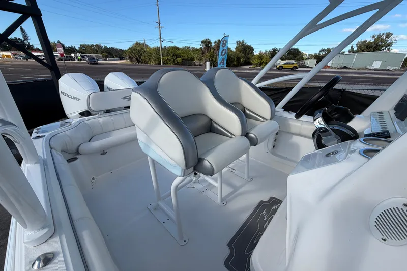 Slide: The Image of 2021 Glasstream 280 SCX boat interior with dual seats and Mercury engines. - 83