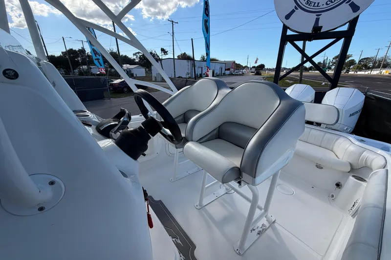 Slide: The Image of 2021 Glasstream 280 SCX boat interior with dual seats and steering wheel. - 84