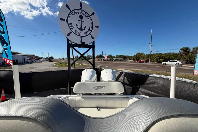 Slide: The Image of 2021 Glasstream 280 SCX boat displayed at a dealership with clear blue skies. - 87