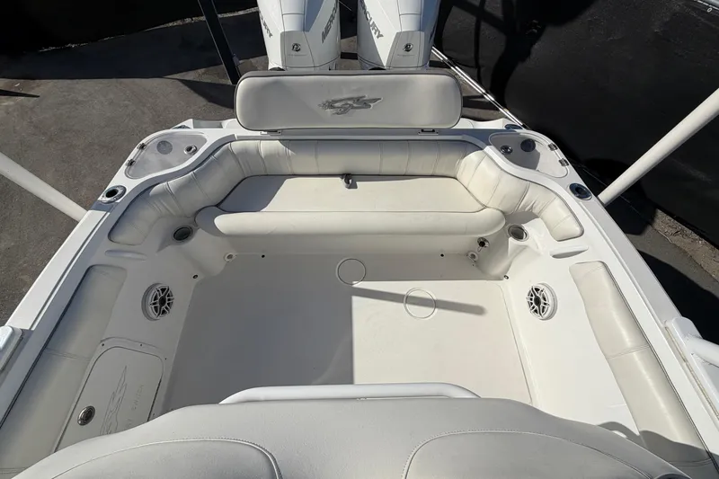 Slide: The Image of 2021 Glasstream 280 SCX boat interior with white seating and speakers. - 89
