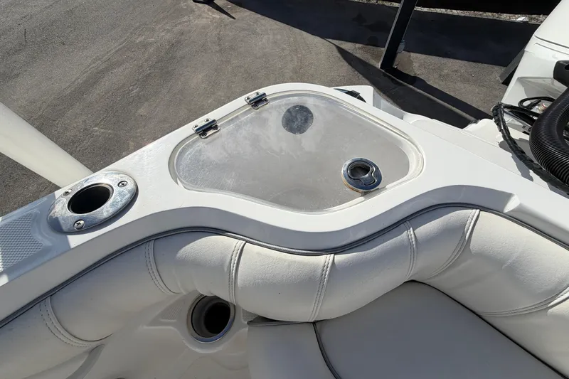 Slide: The Image of 2021 Glasstream 280 SCX boat interior with cup holders and cushioned seating. - 94