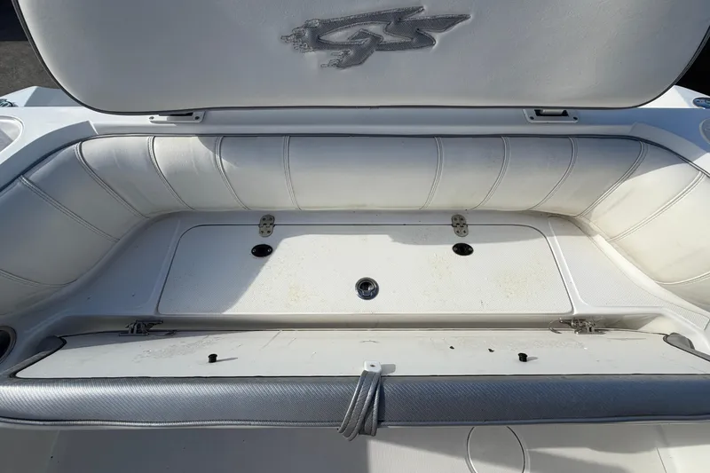 Slide: The Image of 2021 Glasstream 280 SCX boat interior seating with storage compartment. - 99