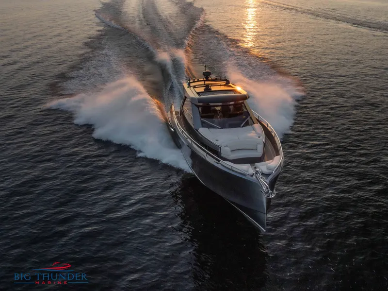 Slide: The Image of 2024 Dutch American Iconic DA 50 yacht cruising at sunset on open water. - 11