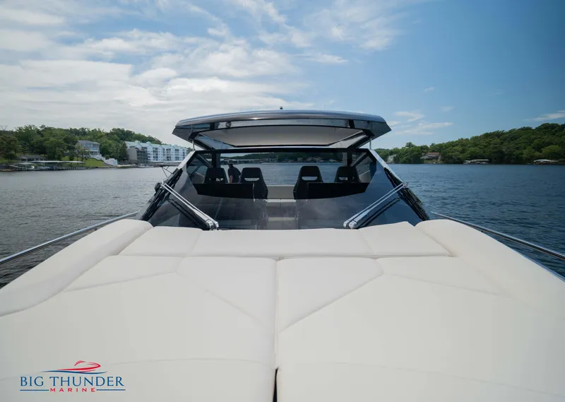 Slide: The Image of 2024 Dutch American Iconic DA 50 yacht on serene lake with lush green shoreline. - 32