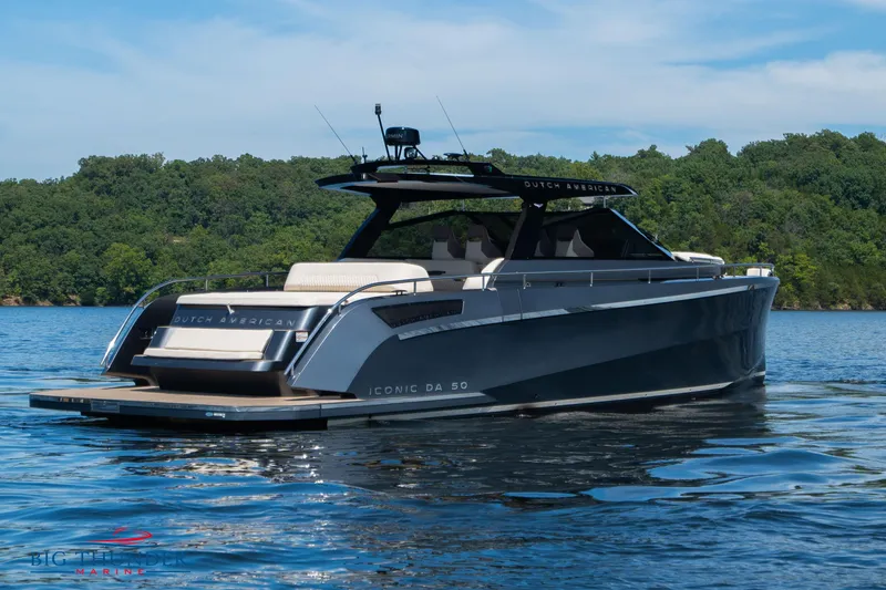 Slide: The Image of 2024 Dutch American Iconic DA 50 yacht on a serene lake. - 4