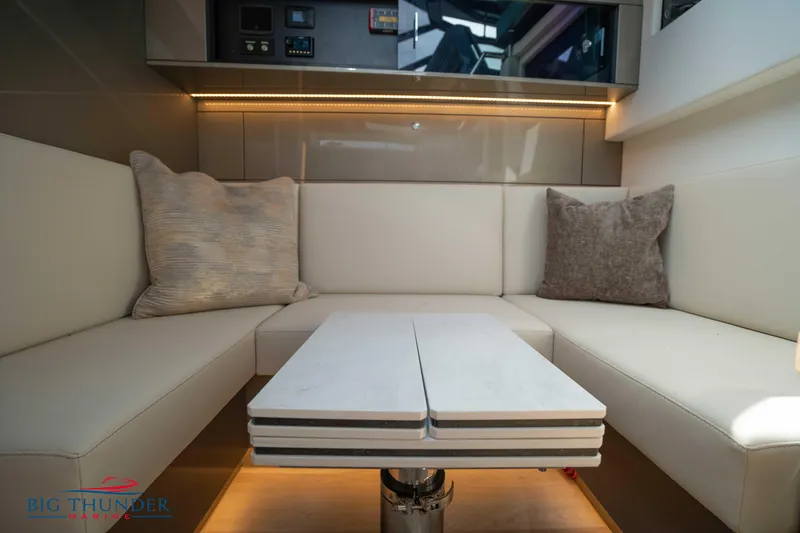 Slide: The Image of Luxurious interior of 2024 Dutch American Iconic DA 50 yacht with plush seating and table. - 42