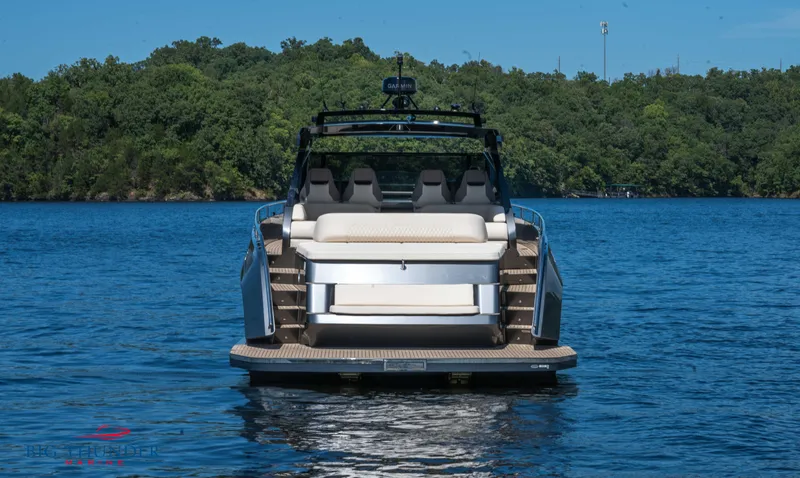 Slide: The Image of 2024 Dutch American Iconic DA 50 boat on a serene lake with lush green background. - 9