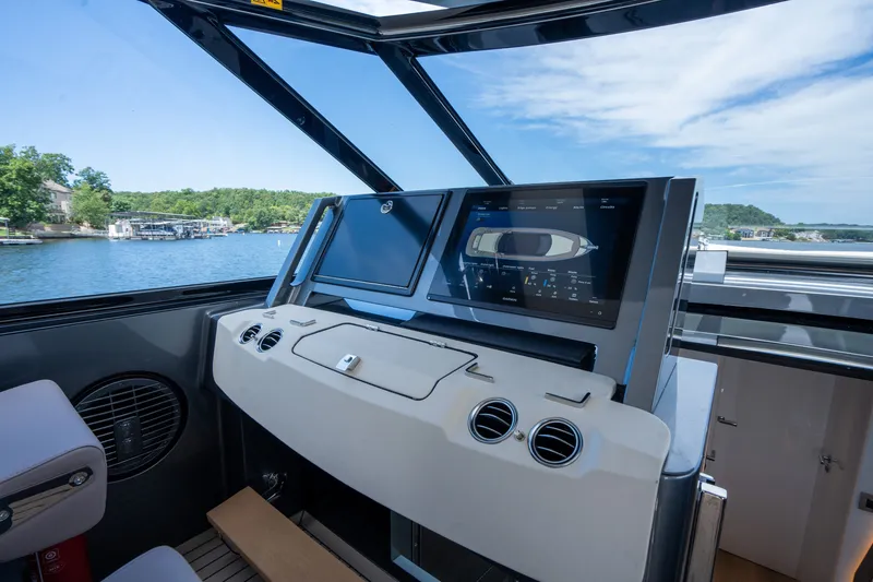 Slide: The Image of 2024 Dutch American Iconic DA 50 yacht cockpit with advanced navigation screens. - 19