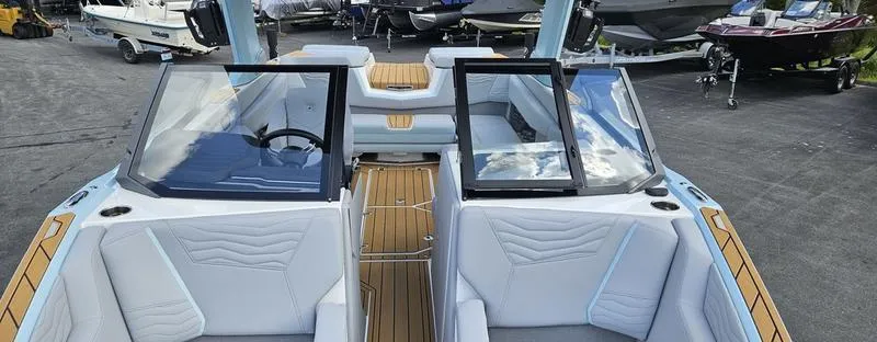 Slide: The Image of 2025 Nautique Super Air Nautique G23 interior with sleek seating and modern design. - 26