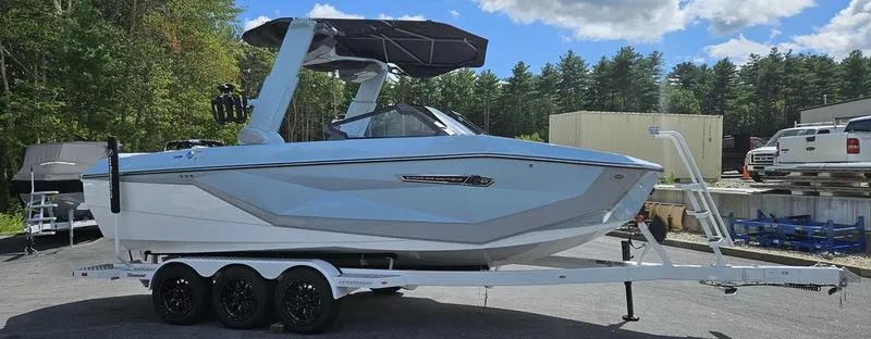 Slide: The Image of 2025 Nautique Super Air Nautique G23 boat on trailer, parked outdoors. - 3