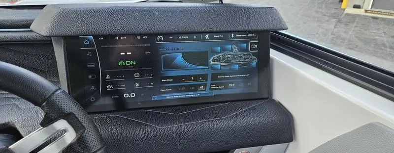 Slide: The Image of 2025 Nautique Super Air Nautique G23 dashboard with advanced touchscreen controls. - 30