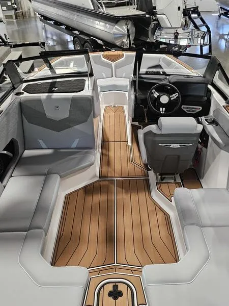 Slide: The Image of 2025 Nautique Super Air Nautique GS20 interior with sleek design and wood accents. - 7