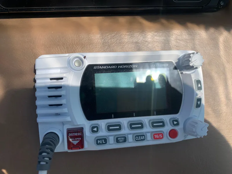 Slide: The Image of Standard Horizon marine radio on 2018 Crownline 264 CR boat dashboard. - 15