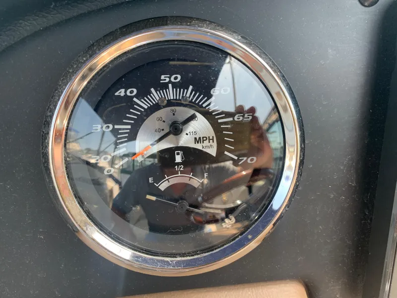 Slide: The Image of Speedometer and fuel gauge of 2018 Crownline 264 CR boat dashboard. - 17