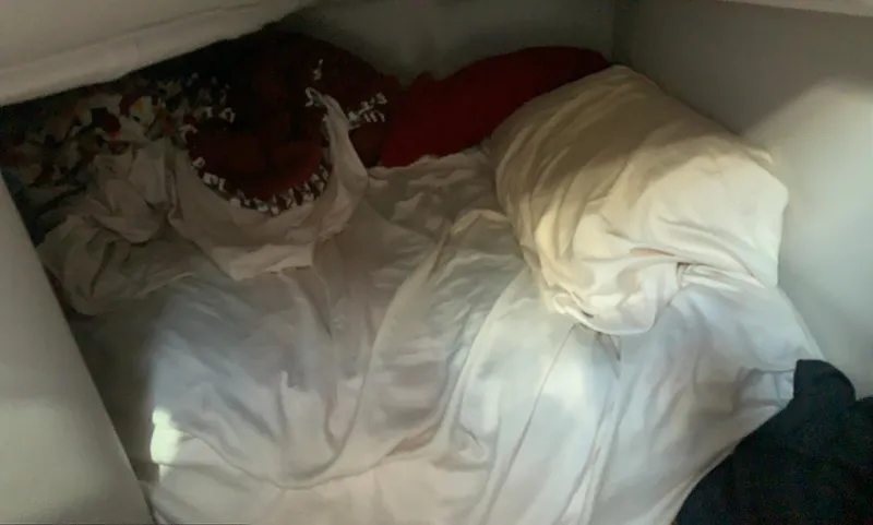 Slide: The Image of Cozy sleeping area inside a 2018 Crownline 264 CR boat cabin. - 29