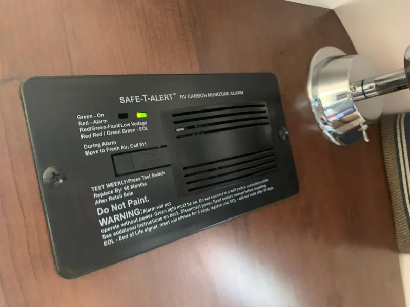 Slide: The Image of Carbon monoxide alarm in 2018 Crownline 264 CR boat interior. - 32