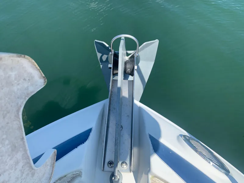 Slide: The Image of Bow anchor of 2018 Crownline 264 CR boat on calm water. - 37