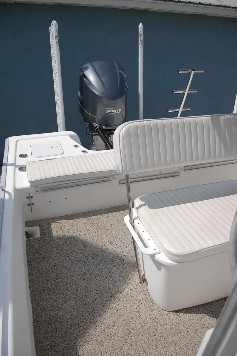 Slide: The Image of 2004 Cape Horn Cape Bay boat interior with seating and outboard motor. - 11
