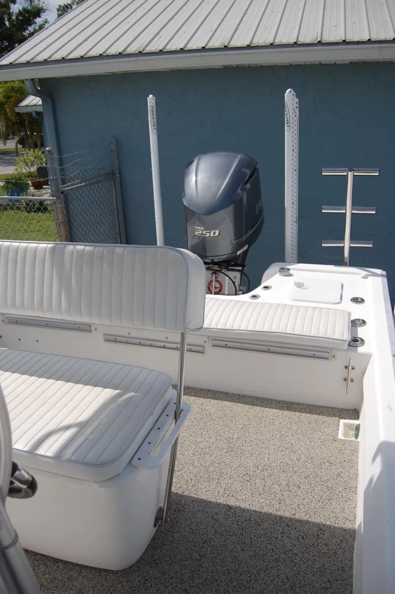 Slide: The Image of 2004 Cape Horn Cape Bay boat interior with seating and outboard motor. - 12