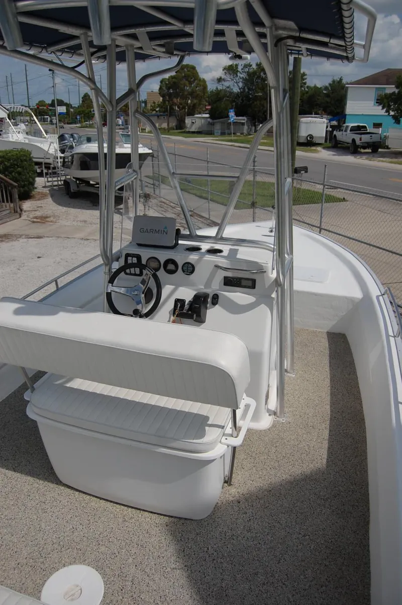 Slide: The Image of 2004 Cape Horn Cape Bay boat interior with steering console and seating. - 14