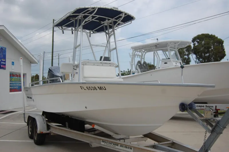 Slide: The Image of 2004 Cape Horn Cape Bay boat on trailer, parked outdoors. - 2