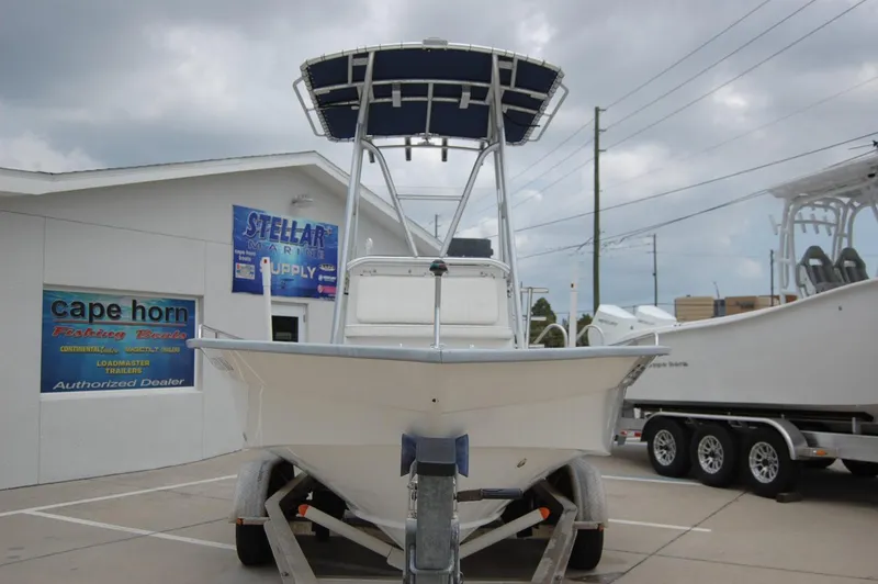 Slide: The Image of 2004 Cape Horn Cape Bay boat on trailer at dealership, overcast sky. - 3
