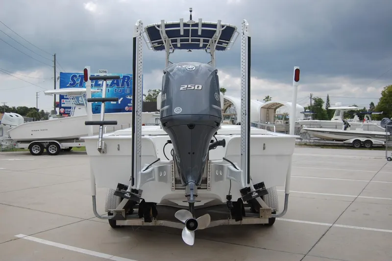 Slide: The Image of 2004 Cape Horn Cape Bay boat with powerful outboard motor in a parking lot. - 6