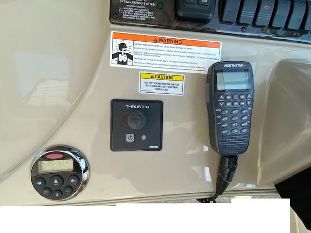 Slide: The Image of Control panel of 2008 Sea Ray 440 Sundancer with thruster and Northstar radio. - 12