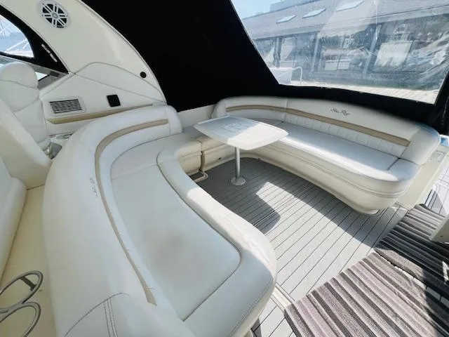 Slide: The Image of Luxurious 2008 Sea Ray 440 Sundancer yacht interior with elegant seating and table. - 13