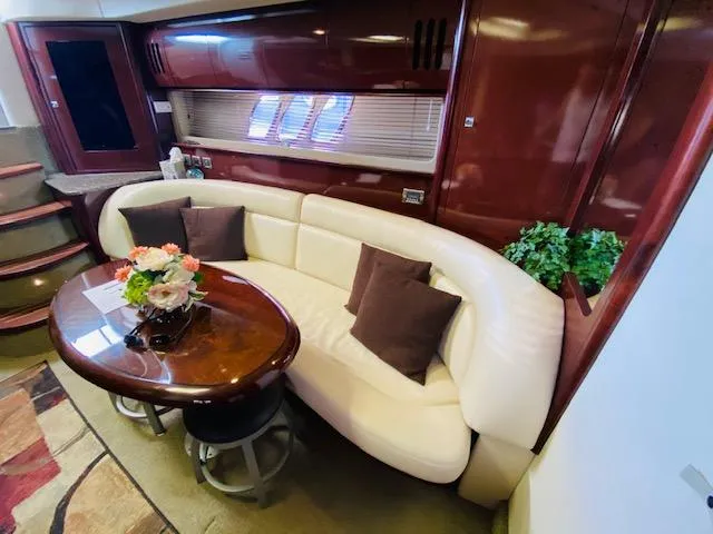 Slide: The Image of Luxurious interior of 2008 Sea Ray 440 Sundancer with elegant seating and decor. - 26